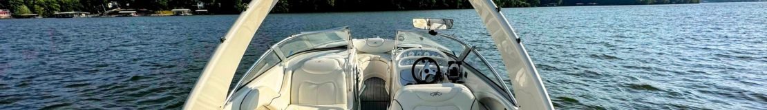 Galley amd Cabin header view of front of boat on the water.